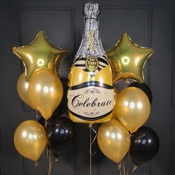 Композиция из шаров золотых и черных с бутылкой шампанского