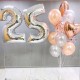 Фонтан из персиковых и серебряных шаров с цифрой 25