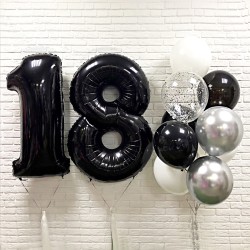 Фонтан из черных, серебряных и белых шаров с цифрой 18