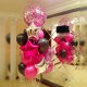 Фонтан из ярко розовых и черных шаров и шар с конфетти