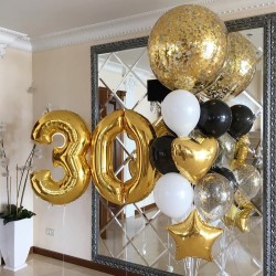 Фонтан с золотой цифрой 30 и большим шаров с золотыми конфетти
