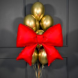 Композиция из золотых шаров с красным бантом Композиция из золотых шаров с красным бантом