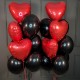 Композиция из черных шаров с красными сердцами